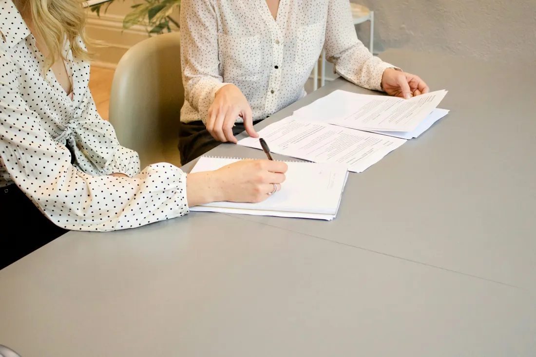 Mortgage advisor reviewing documents with a client